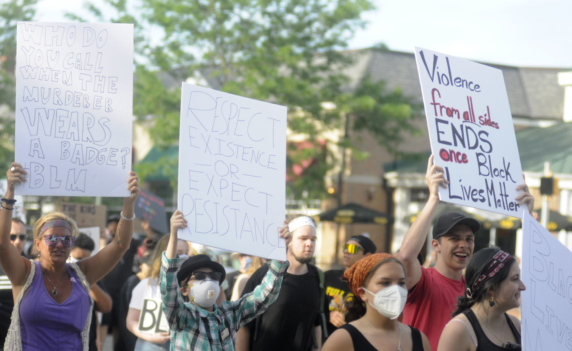 Demonstrators march across Main Street